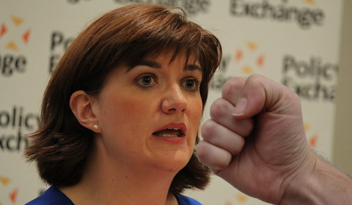 A fist hitting Nicky Morgan MP In the face.